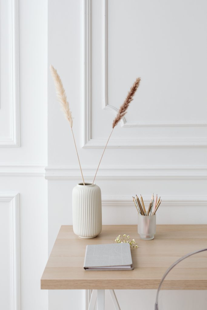 Minimalist desk setup with elegant decor and stationery for a clean and serene workspace.
